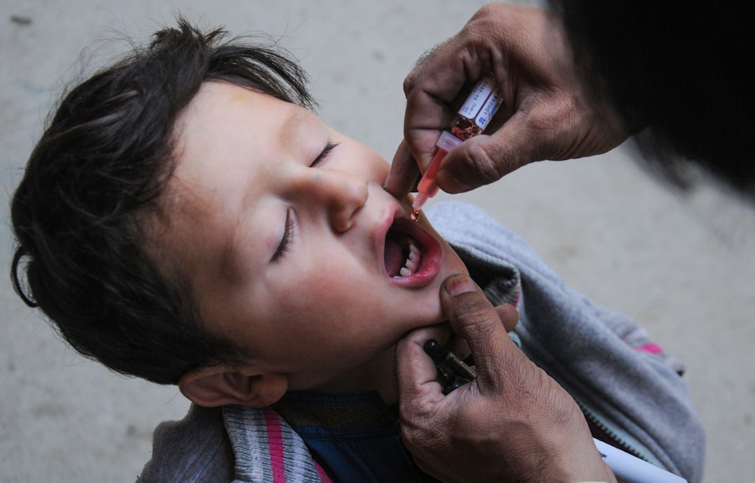 Children receiving polio vaccination drops